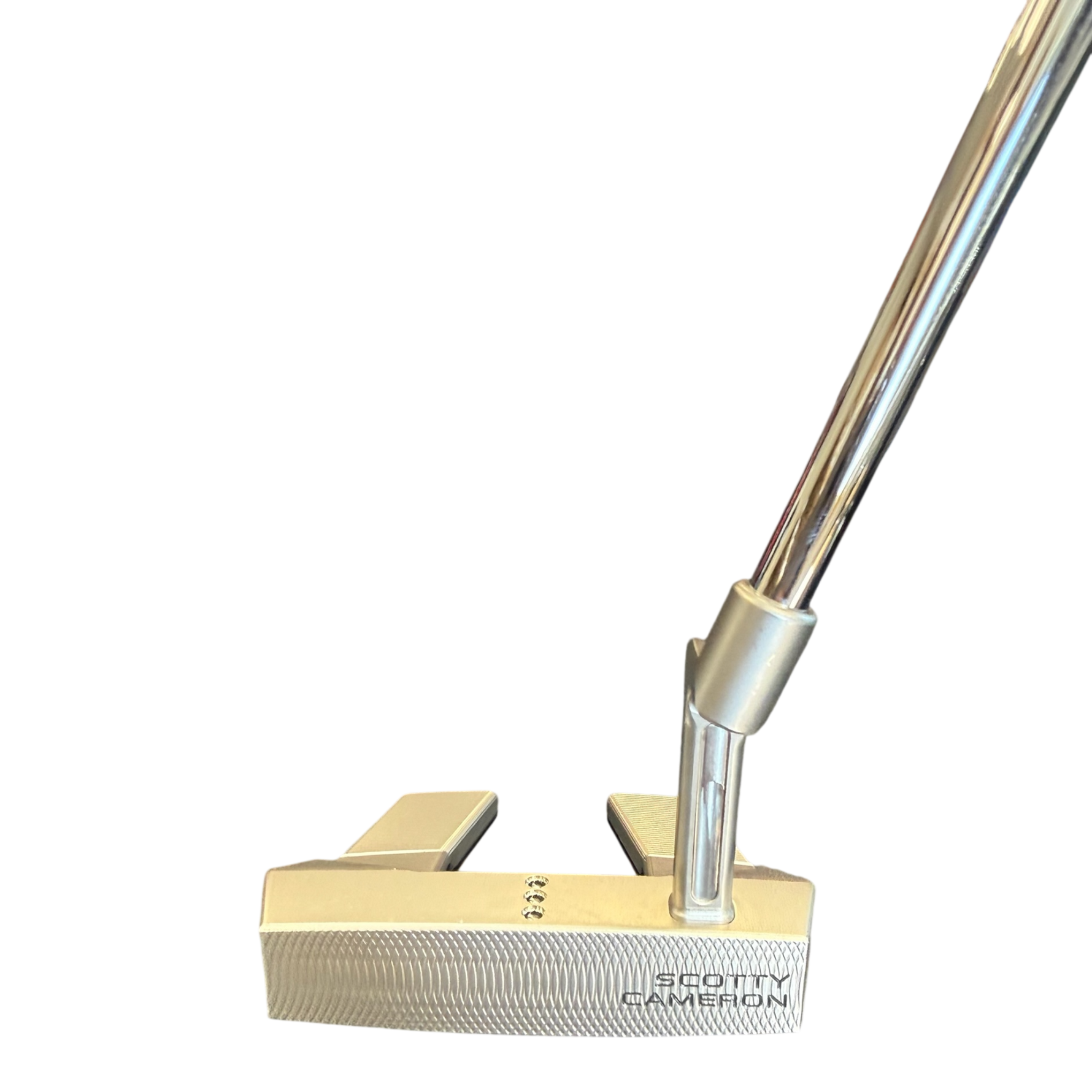 Gold golf putter with Scotty Cameron branding on a white background